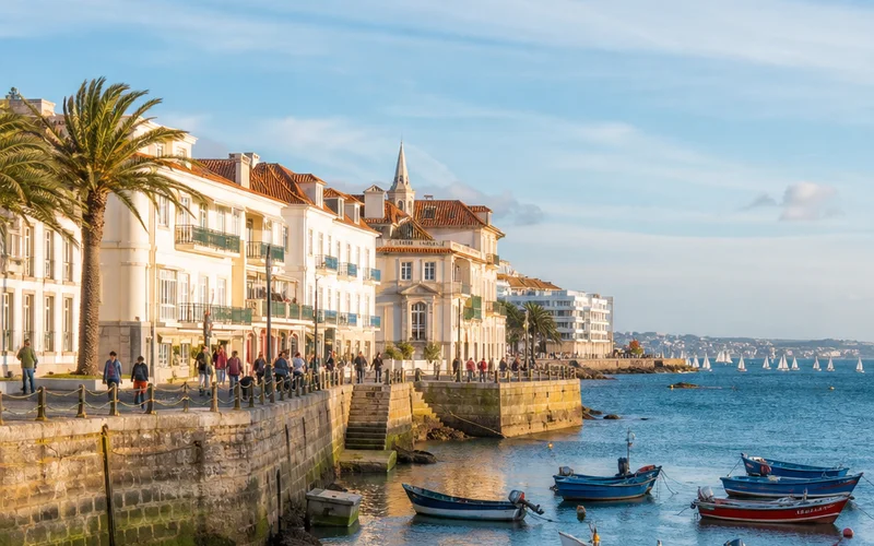 Cascais waterfront day trip from Lisbon with fishing boats and ocean views.