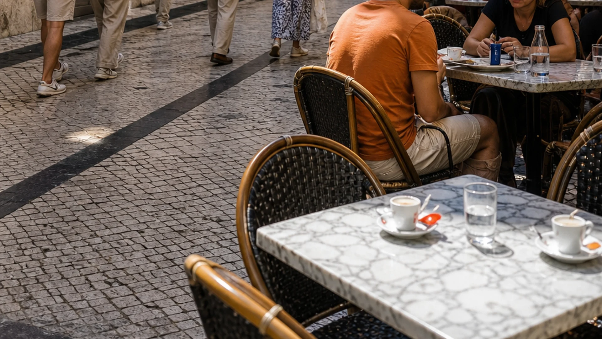 Lisbon café street scene showing typical budget dining options for travelers.
