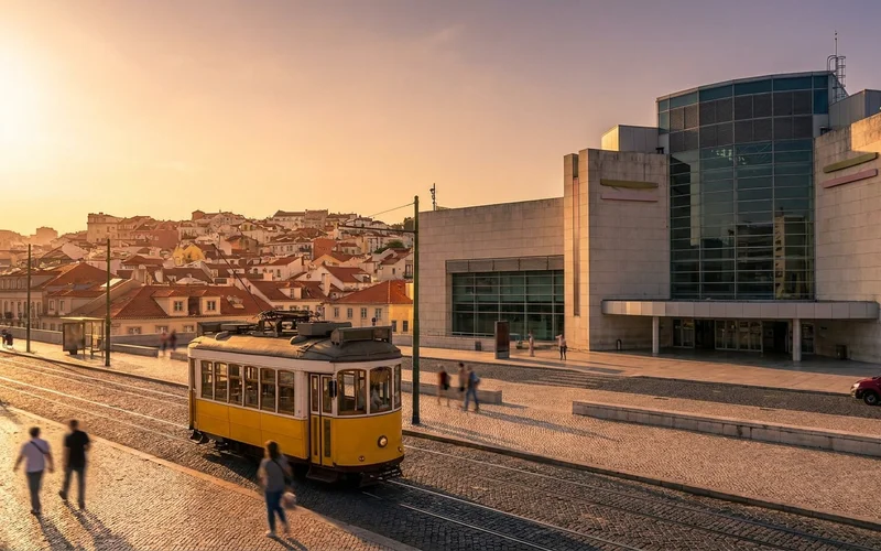 Arriving in Lisbon Portugal airport with city trams and rooftops visible.
